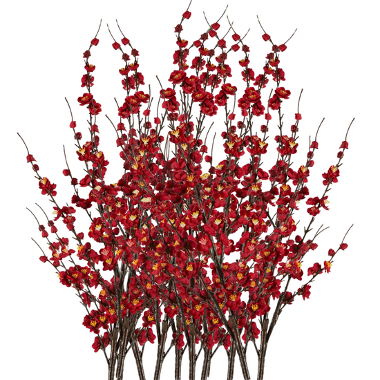 Artificial red floral branch on a white background