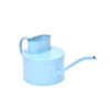 Light blue watering can on a white background