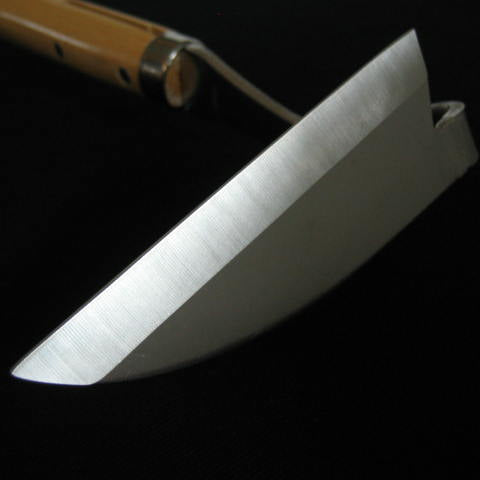 Knife with a metallic blade and wooden handle on a black background
