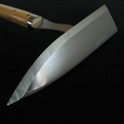 Metal spatula with wooden handle on a black background