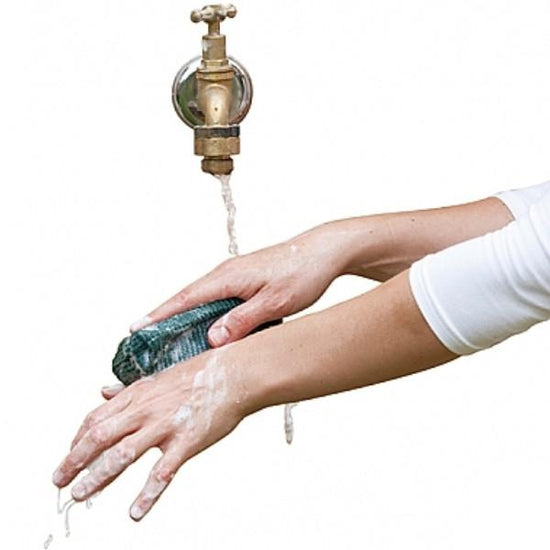 running tap with hands scrubbing clean Australian gardeners soap