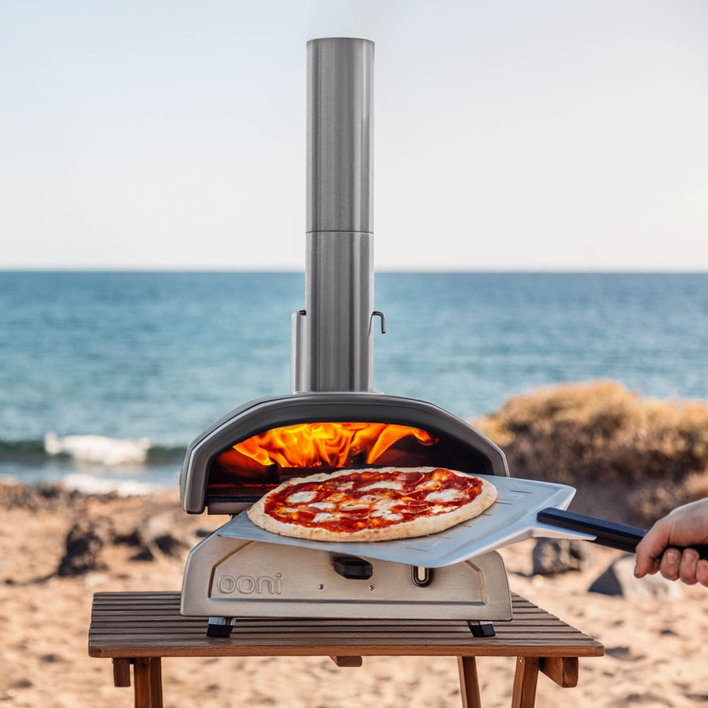 Load image into Gallery viewer, OONI Fyra 12 Portable WoodFired Pellet Outdoor Pizza Oven, Cover + Peel , Pizza Slicer and 1kg Pellets **CLEARANCE**