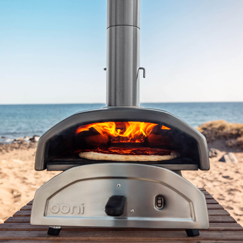 Load image into Gallery viewer, OONI Fyra 12 Portable WoodFired Pellet Outdoor Pizza Oven, Cover + Peel , Pizza Slicer and 1kg Pellets **CLEARANCE**