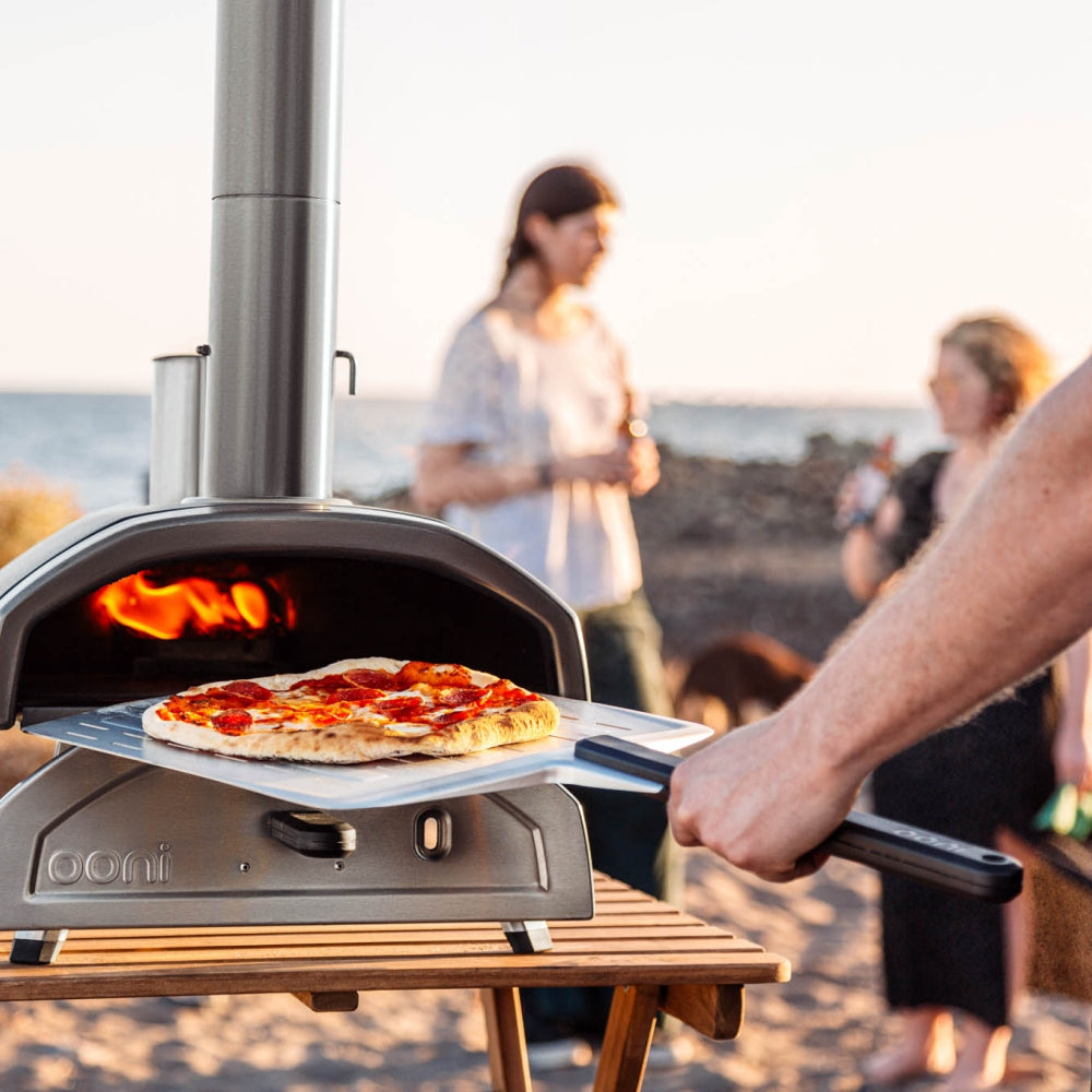 Load image into Gallery viewer, OONI Fyra 12 Portable WoodFired Pellet Outdoor Pizza Oven, Cover + Peel , Pizza Slicer and 1kg Pellets **CLEARANCE**