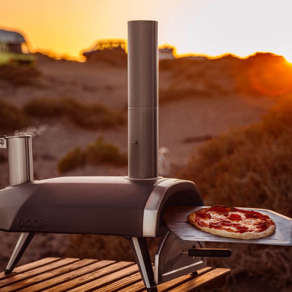 Load image into Gallery viewer, OONI Fyra 12 Portable WoodFired Pellet Outdoor Pizza Oven, Cover + Peel , Pizza Slicer and 1kg Pellets **CLEARANCE**