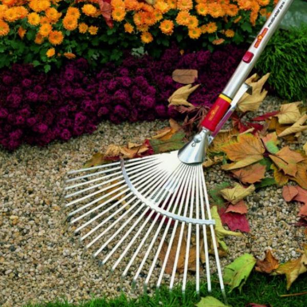 Load image into Gallery viewer, Raking a WOLF GARTEN Multi-change Adjustable Rake