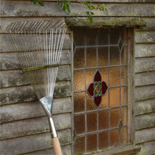 Load image into Gallery viewer, BURGON &amp; BALL  |  Flexi-Tined Lawn Rake outside a barn